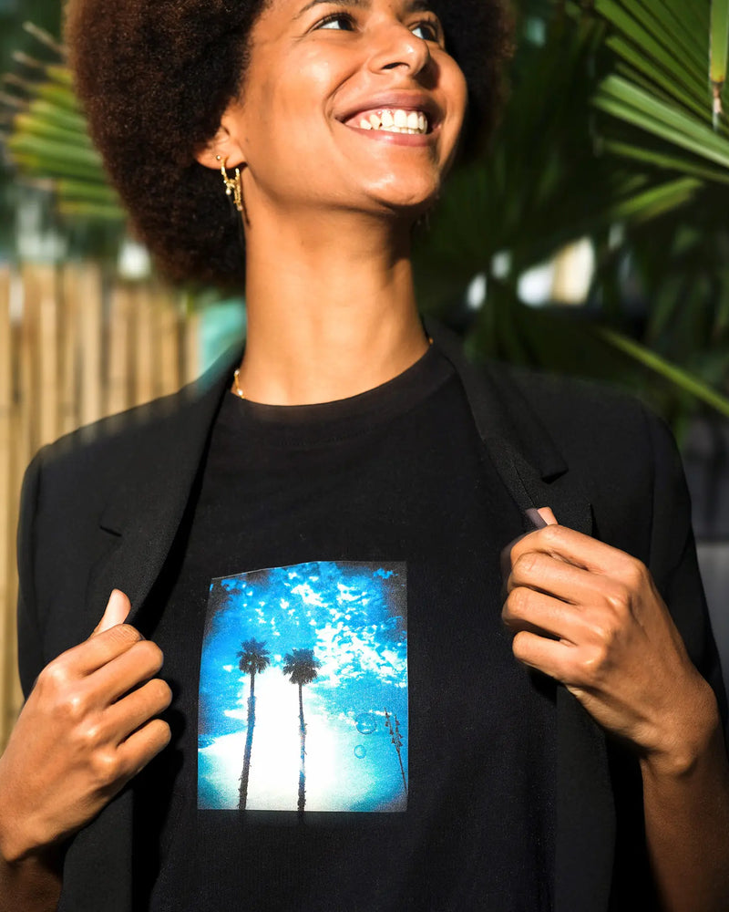 Gratitude, "Bubbles and Sky Sticks" organic t-shirt worn open under a blazer