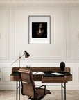 A home office with a wooden desk, brown chair, black desk lamp, and a black sculpture features conscious interior design. Two wall sconces, a plant, a brass telescope, and inspirational wall art complete the stylish space.