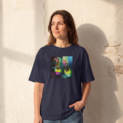 Adventurous - "Dancing in Colours" French Navy T-shirt worn against a sunlit plaster wall