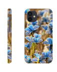 A phone case is shown from the side and back, featuring photo art of blue butterflies on a blurred natural background, with the word INTENTION printed near the bottom on the back.