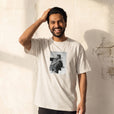 Fortitude - "Everyday Hero" Off White T-shirt worn against a sunlit plaster wall