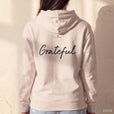 Grateful - "Circle of Life" Hoodie creamy pink worn from behind, the Word across the shoulder blades
