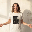 Hopeful - "A Dreamer’s Strength" Off White T-shirt worn against a sunlit plaster wall