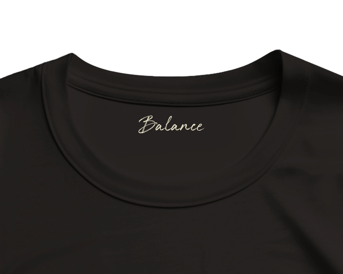 Balance, the Word of Intention printed inside the neck of a deep black T-shirt