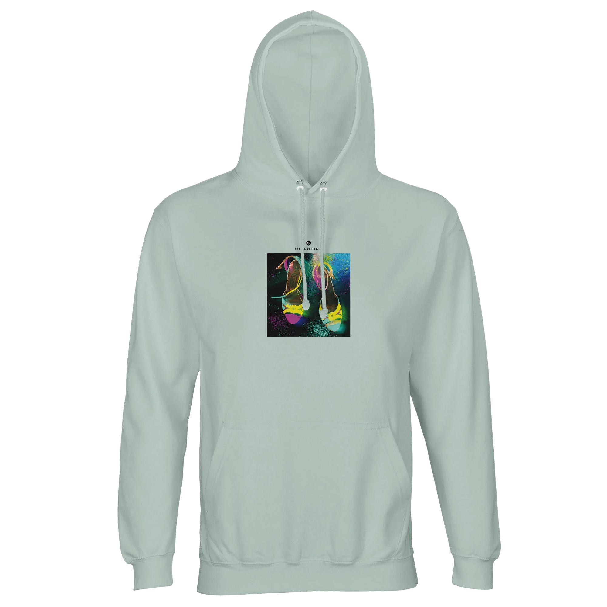 A creamy green hooded sweatshirt featuring a square art print on the front with a colorful, artistic illustration of high-heeled shoes on a textured background.