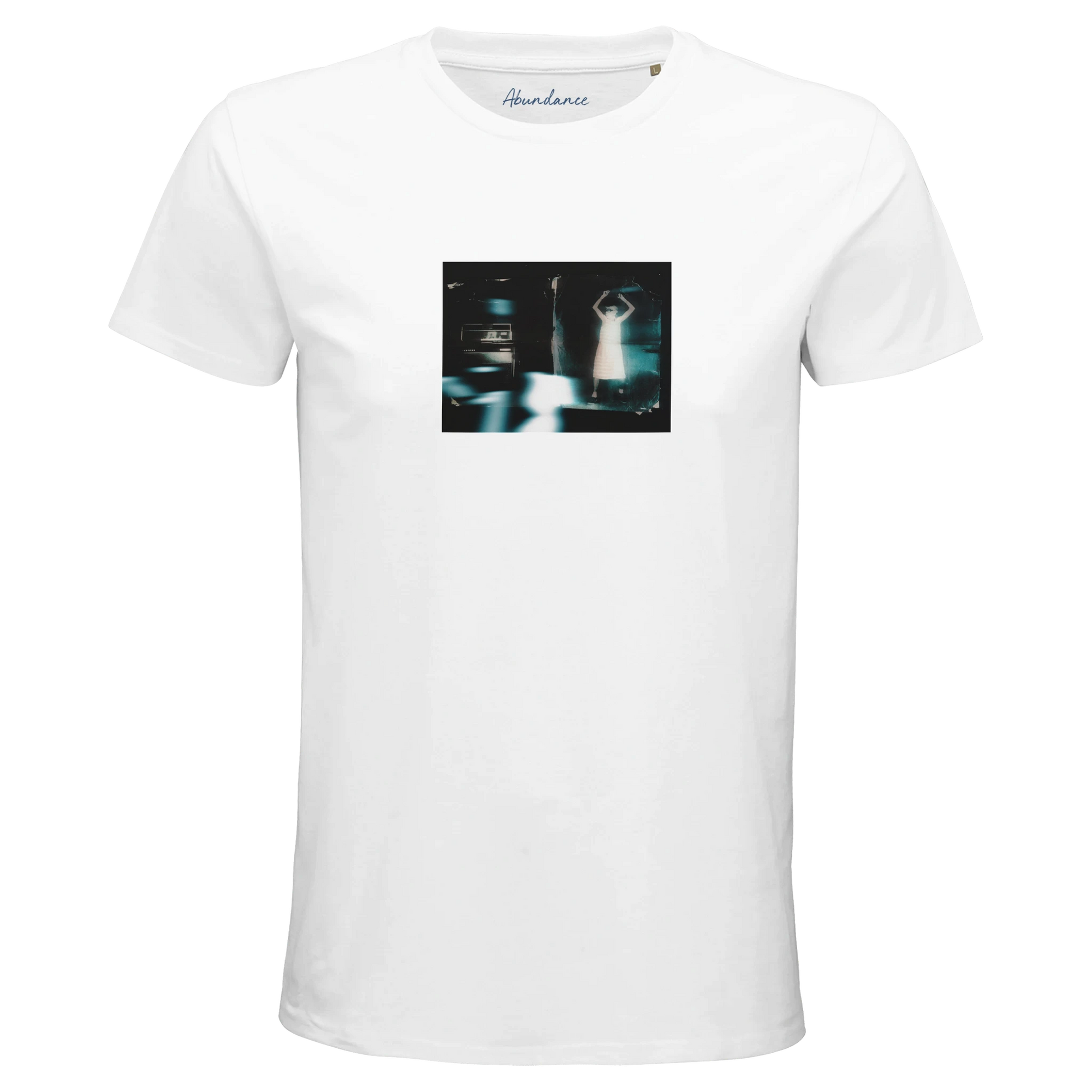 A white short-sleeve t-shirt from mindful apparel featuring a small, blurry rectangular image on the chest, showing a person standing between two cars at night with their arms raised above their head.
