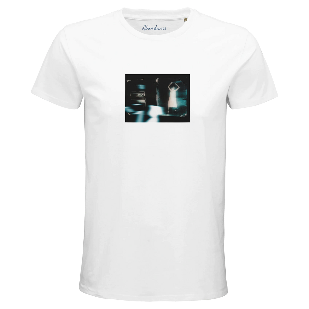 A white T-shirt with a small, centered rectangular art print of a blurred figure with raised arms near a car at night. “Abundance” is printed inside the collar for mindful detail. Color: White.