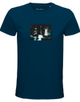 A denim t-shirt with an art print on the chest shows a blurred, blue-toned figure with raised arms by a car at night. "Abundance" is printed inside the collar, reflecting mindful apparel and conscious fashion.