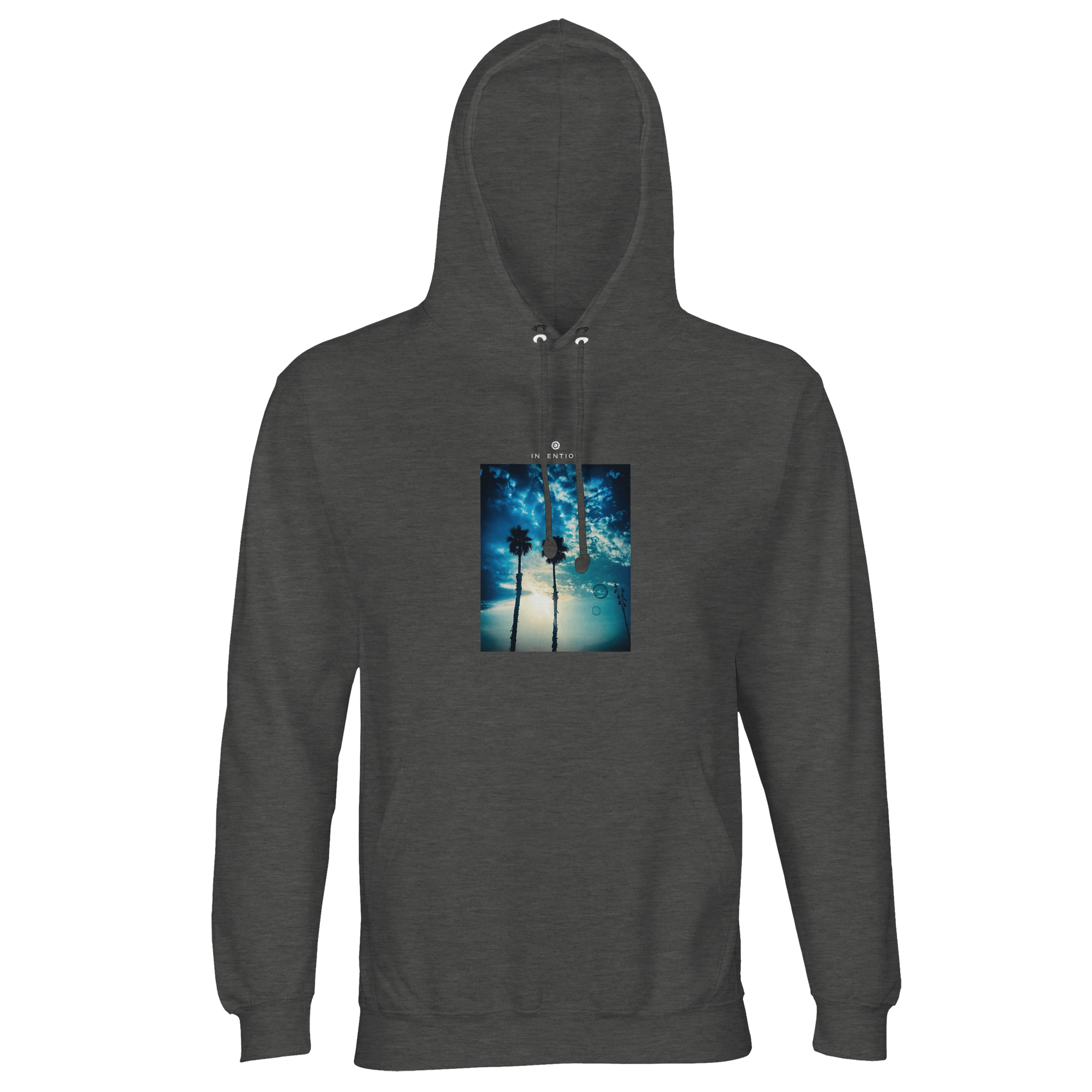 A Grey Melange hooded sweatshirt displays an art print of two tall palm trees silhouetted against a blue sky with sunlight filtering through clouds—ideal for fans of mindful apparel.