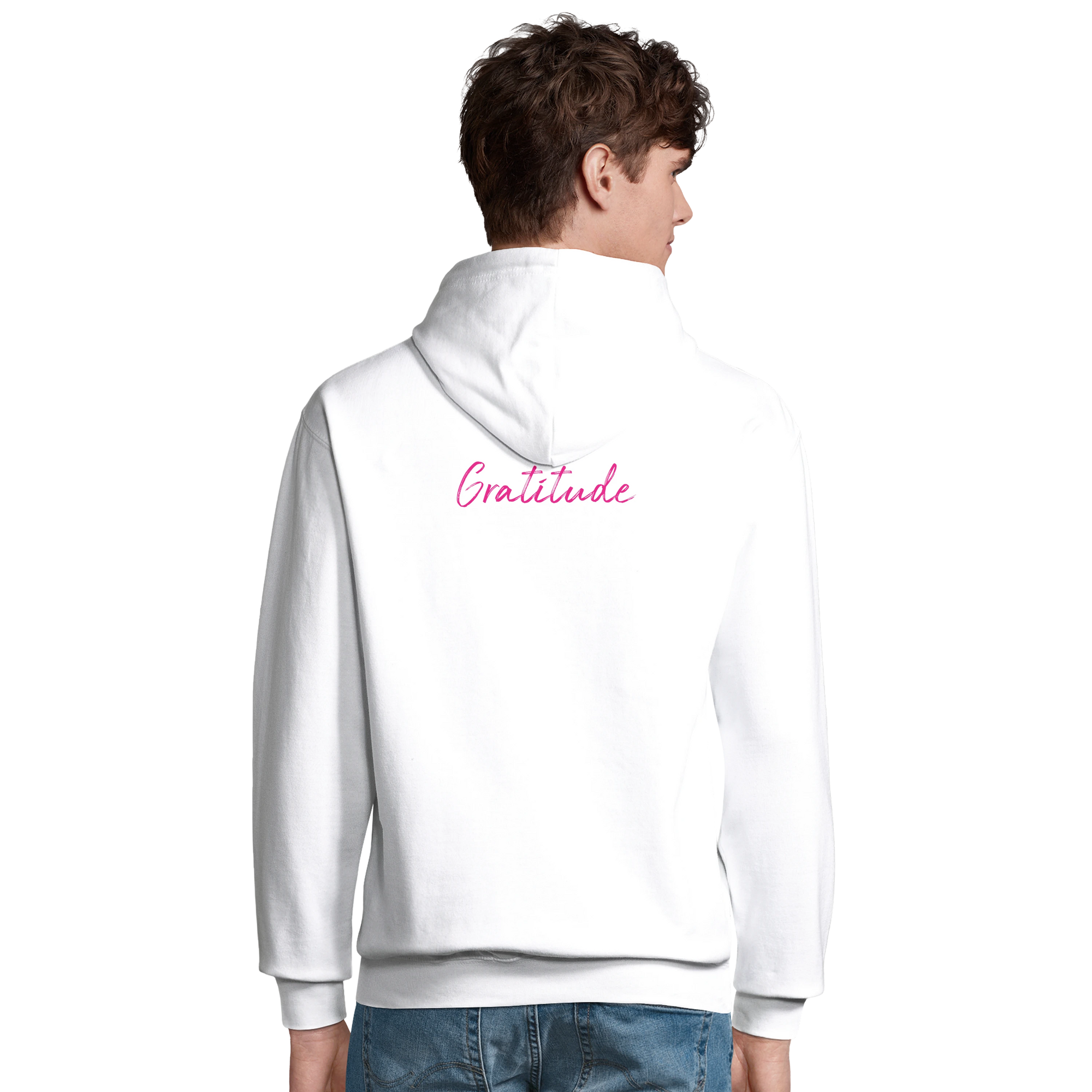 A person wearing a white hooded sweatshirt with the word Gratitude in pink script on the back, standing against a plain light background—an expression of conscious fashion and mindful apparel.