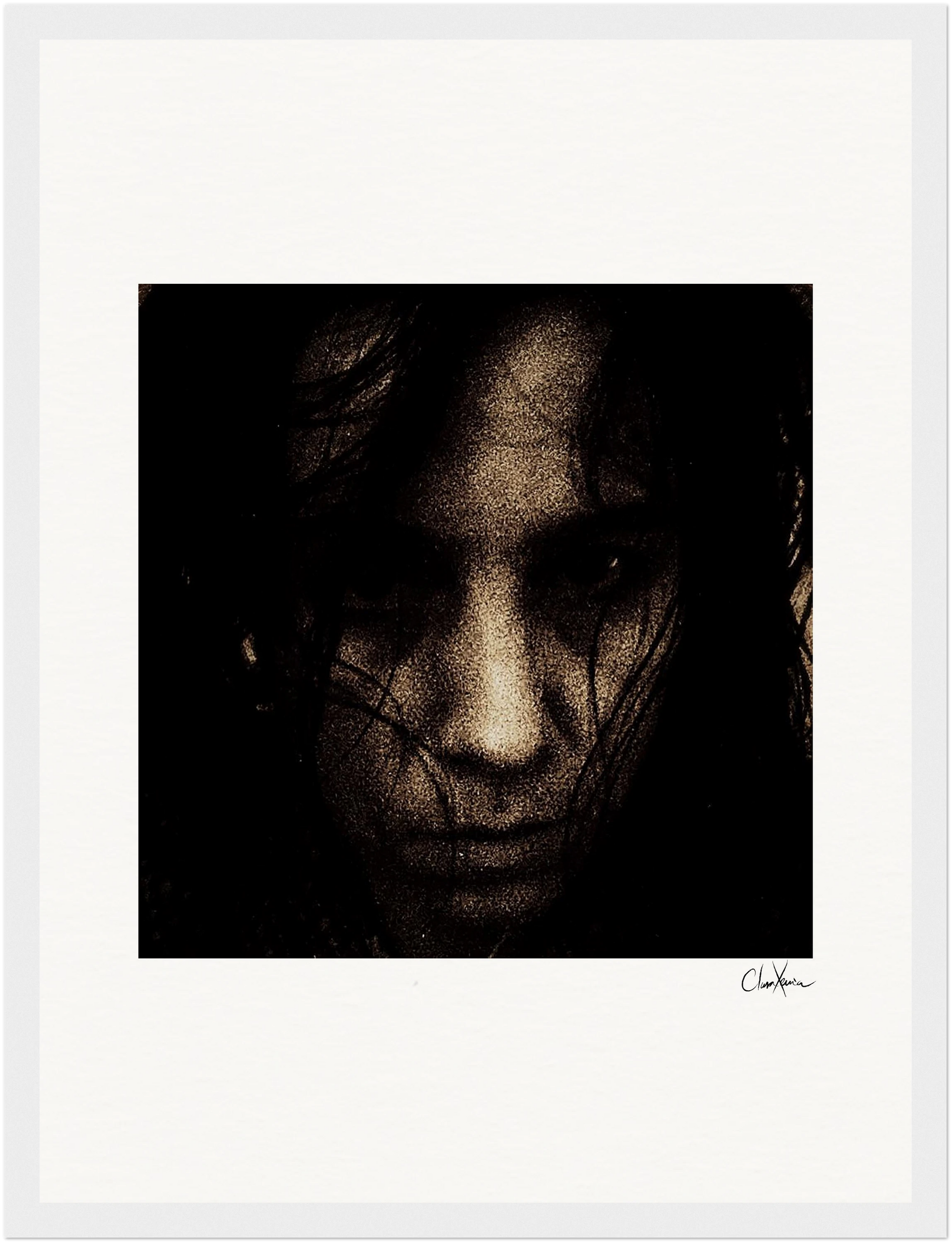 A close-up, grainy image of a person's face in shadow, dark hair partially covering their features. The serious expression is complemented by a wide white border and a signature at the bottom right—perfect as a gallery-quality frame or fine art print.