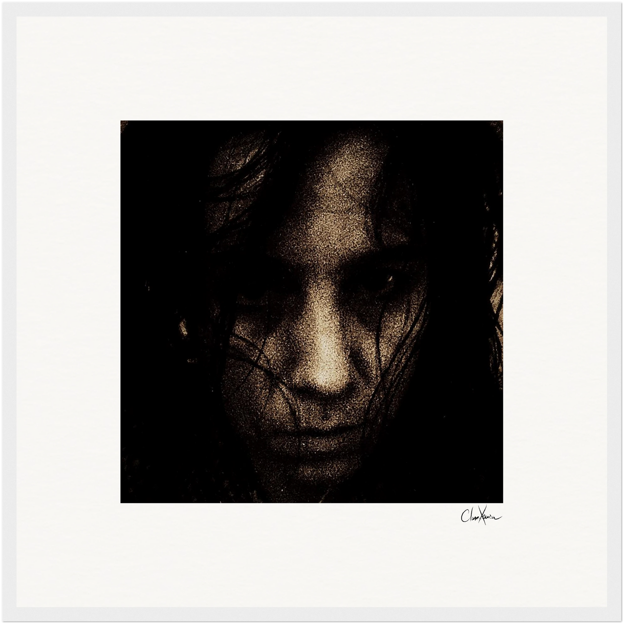 A close-up image of a person’s face in low light, with dark hair partially covering their features. The serious expression and grainy, high-contrast effect create a striking fine art print, complete with a signature in the bottom right corner.
