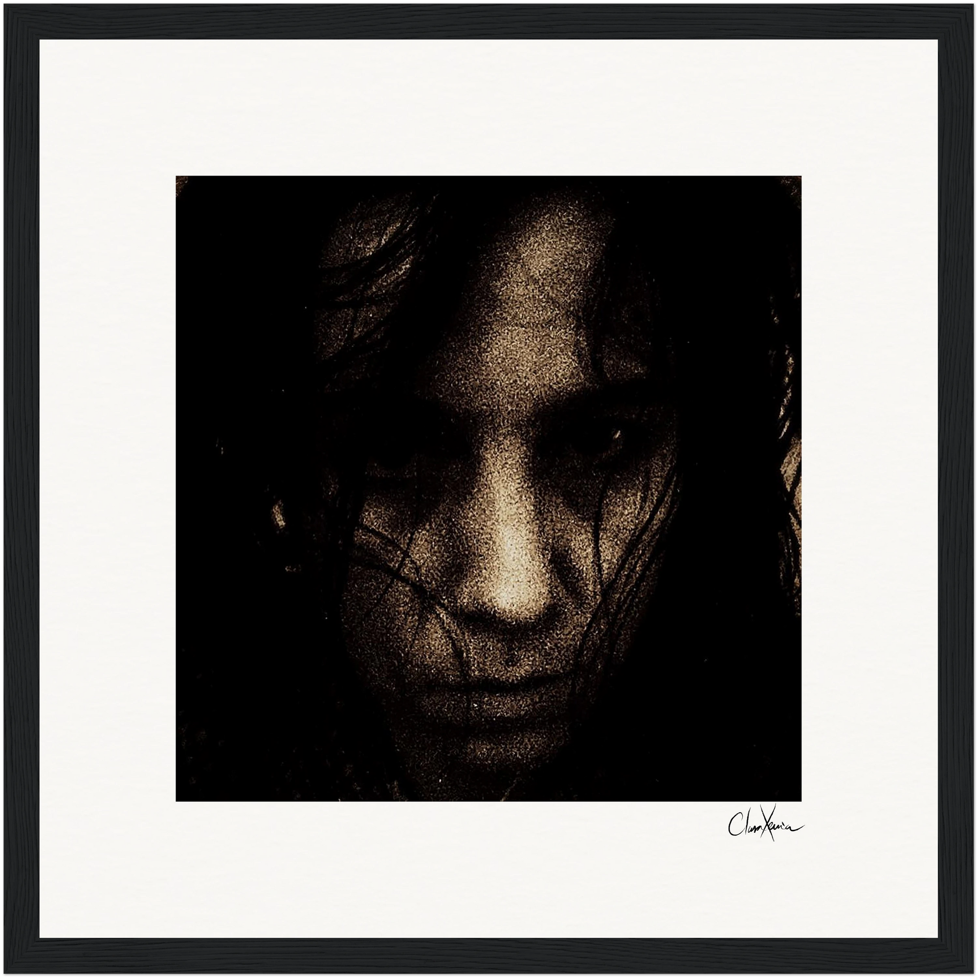 A dark, grainy close-up of a person's face with long hair partially covering their features, set against a plain background and framed in black. This fine art print adds a sophisticated, contemplative touch to mindful home decor.