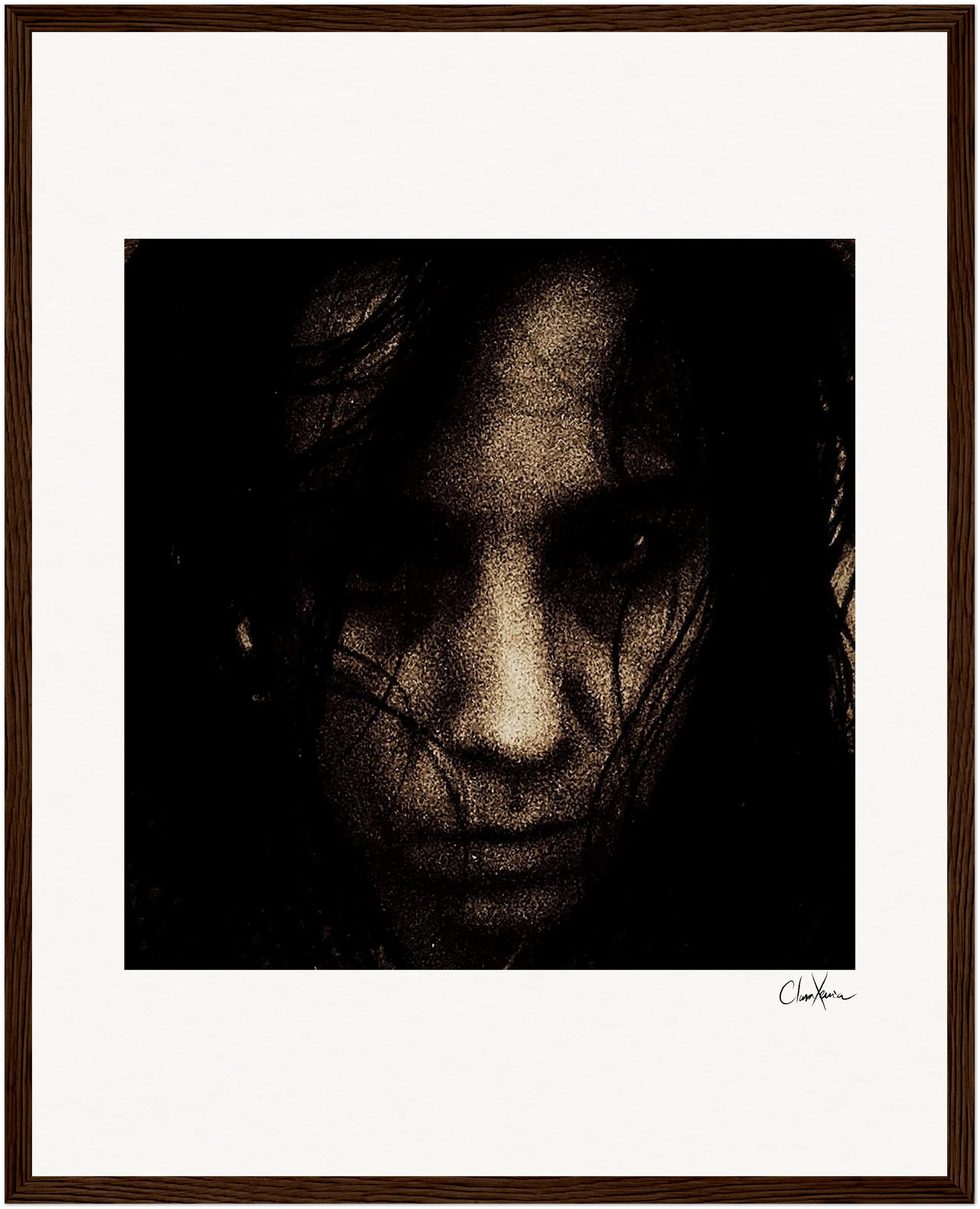 A dark, grainy close-up image of a person’s face with an intense expression, partially obscured by shadows and hair. This inspirational wall art is centered within a gallery-quality frame and white mat. A signature appears in the lower right corner.