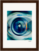 A close-up photo of the circular front door of an Electrolux washer, with reflections and blue tones. This fine art print is displayed in a brown wooden gallery-quality frame with a white mat and an artist signature at the bottom right.