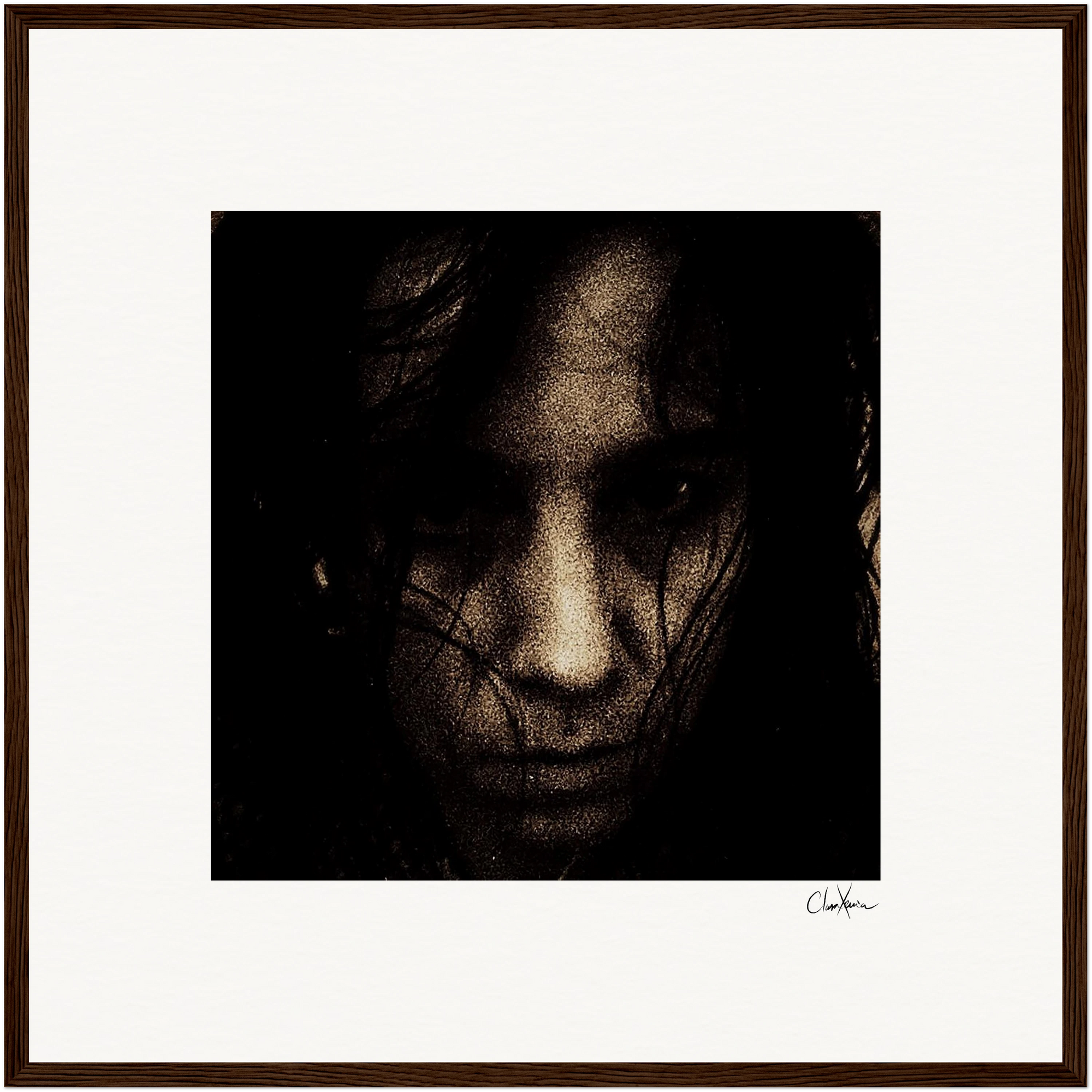 A close-up image of a person's face in dim lighting, partially obscured by shadows and strands of dark hair, photographed in a gritty, textured style. This framed wall art is centered on a white background with a dark frame.