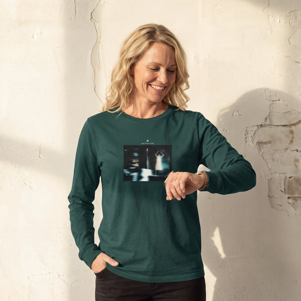 Abundance - "Vibe of Life" green empire Long Sleeve worn against a sunlit plaster wall