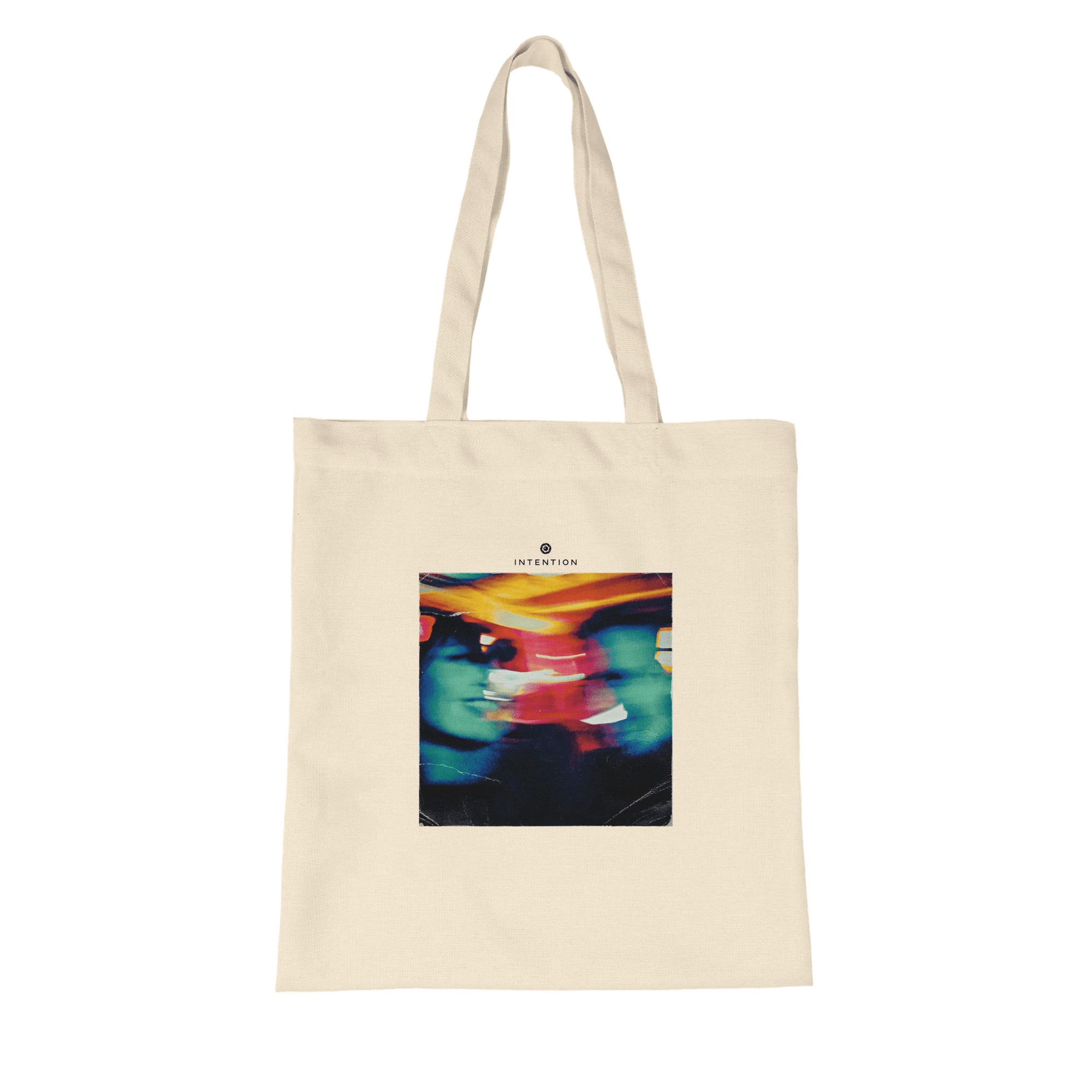 A natural tote bag with two long handles, made from organic material and featuring a colorful abstract image of two faces with "INTENTION" above—an ideal pick for mindful apparel lovers.