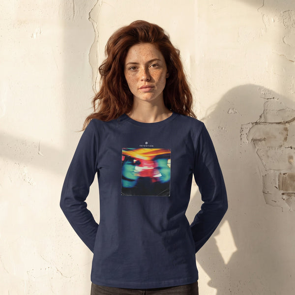 Alive - "Moving Smiles" French Navy Long Sleeve worn against a sunlit plaster wall