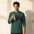 Balance - "Shadow of Self" green empire Long Sleeve worn against a sunlit plaster wall
