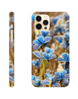 A smartphone case featuring a vibrant blue butterfly art print on a blurred natural background, shown from back and side angles to highlight the camera cutout, side buttons, and detailed photo art textures.