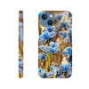Phone case featuring an art print of blue butterflies and textured brown grass, shown from the back and side views. The photo art design includes the word INTENTION at the bottom on the back view.