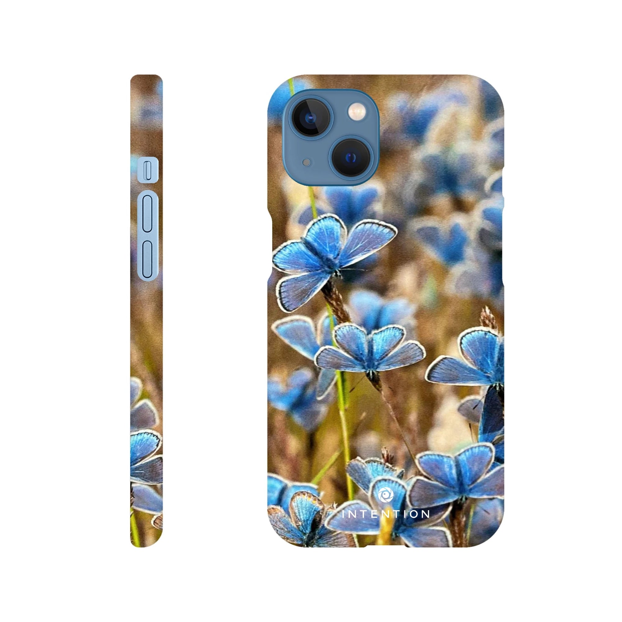 Phone case featuring an art print of blue butterflies and textured brown grass, shown from the back and side views. The photo art design includes the word INTENTION at the bottom on the back view.