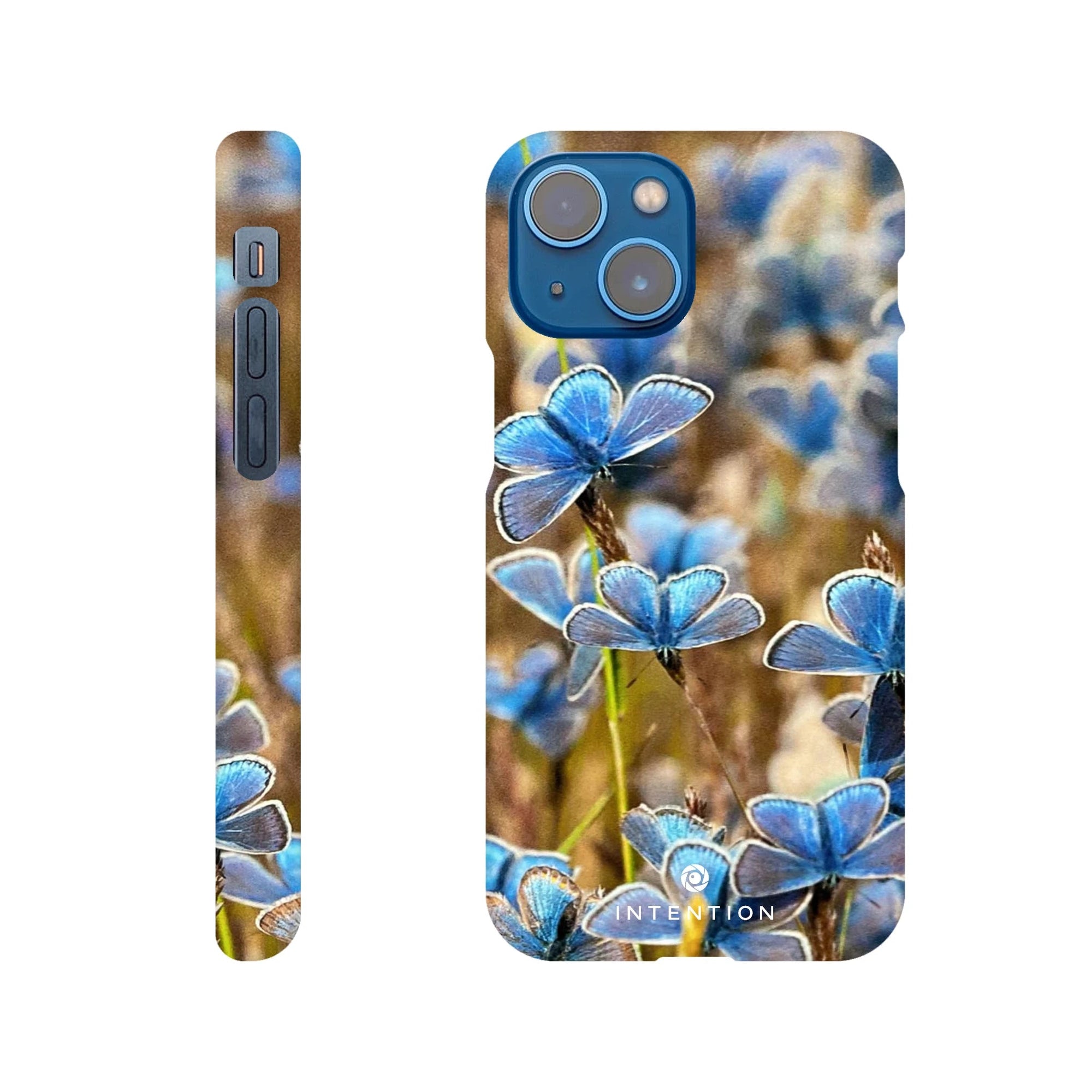 A phone case featuring a close-up photo art of multiple blue butterflies resting on plants, shown from the back and side, with beautiful textures. The word INTENTION is printed near the bottom of the case.