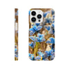 A phone case featuring an art print of blue butterflies resting on grass is shown from the side and back. The textured back displays the word INTENTION and a small circular logo near the bottom.