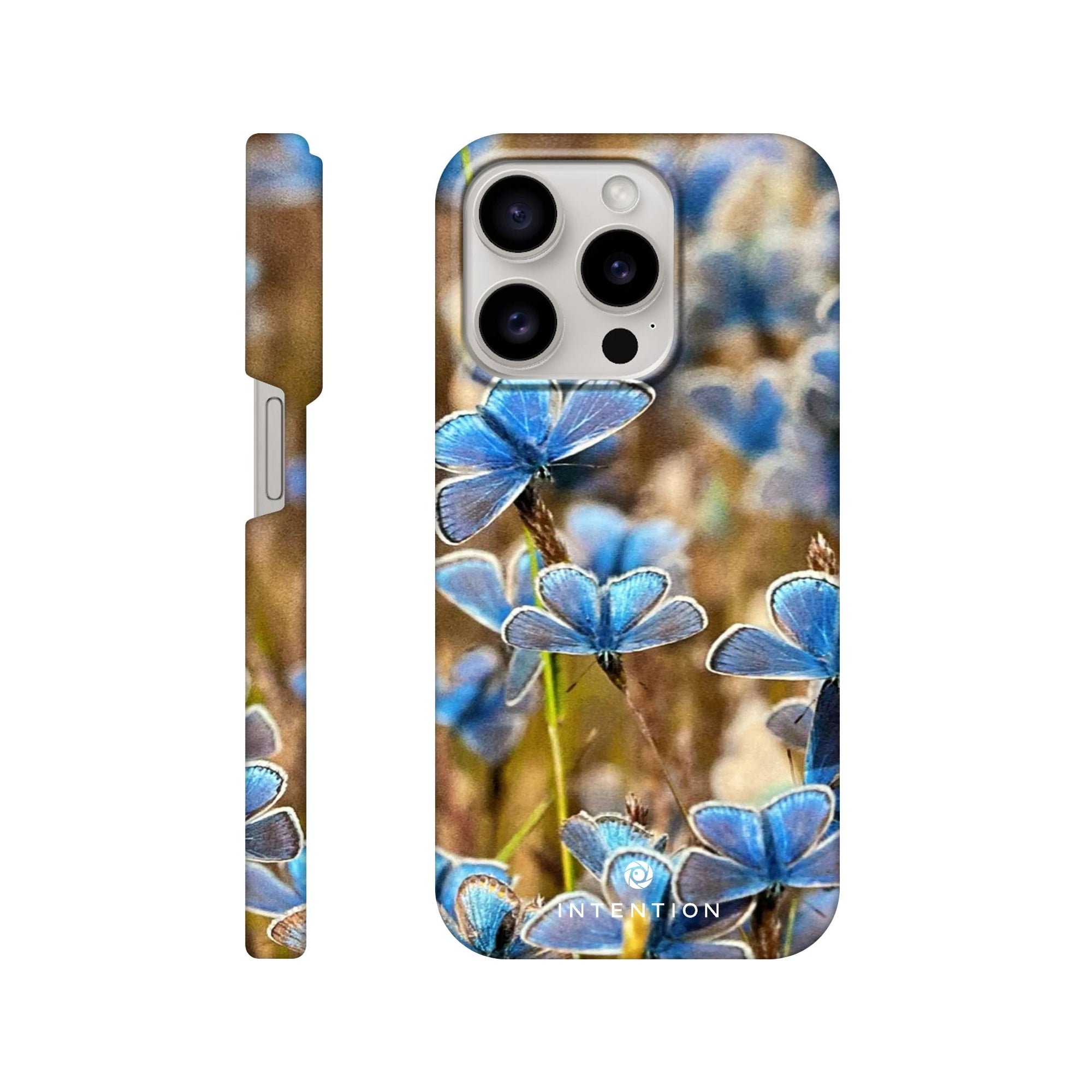 A smartphone case featuring photo art of blue butterflies on grass, highlighted with rich textures. The word INTENTION is printed at the bottom of the back view. Shown from the side and back.