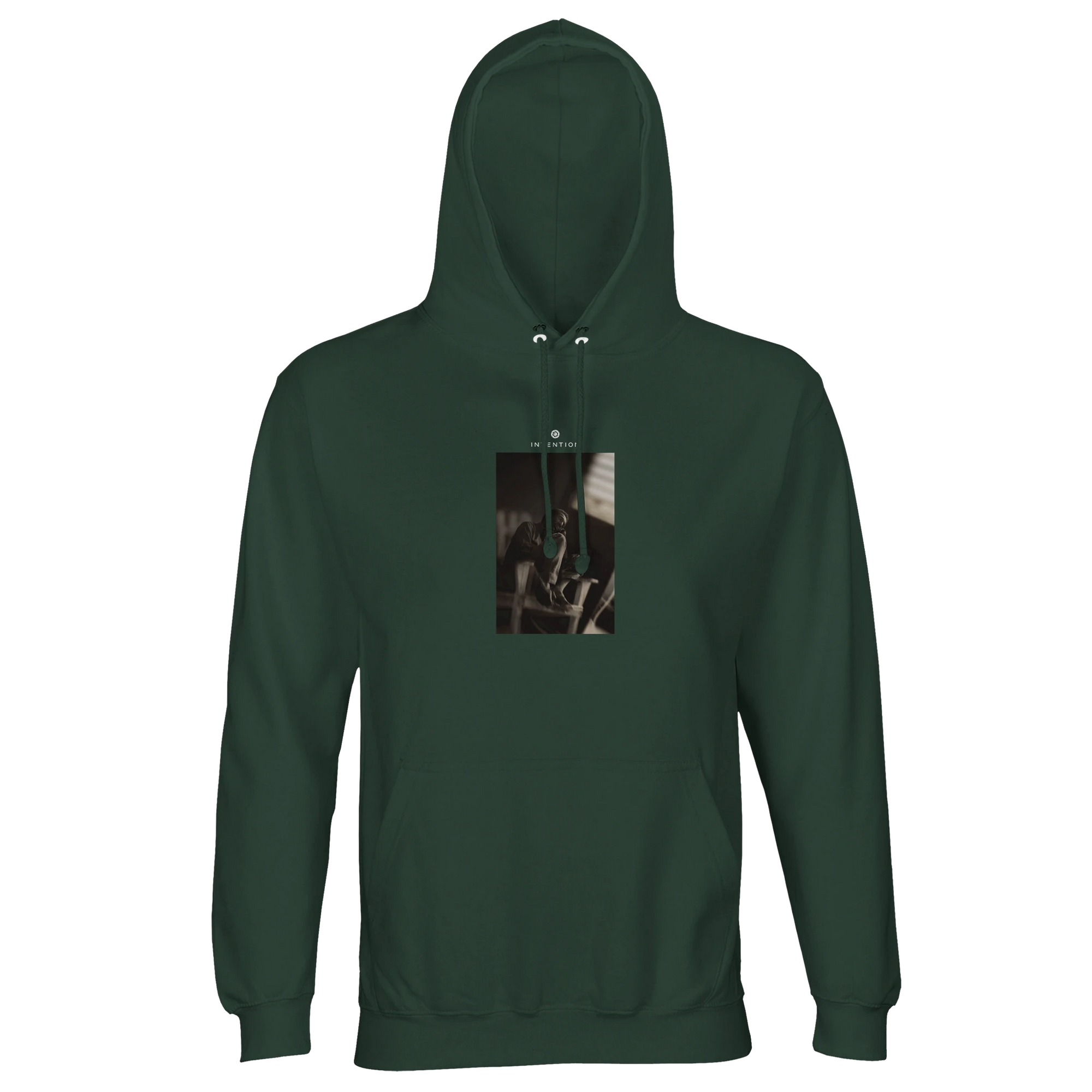 A bottle green hooded sweatshirt with a centered chest art print showing a close-up of an object with metal hardware against a brown background—ideal for those who value mindful apparel.