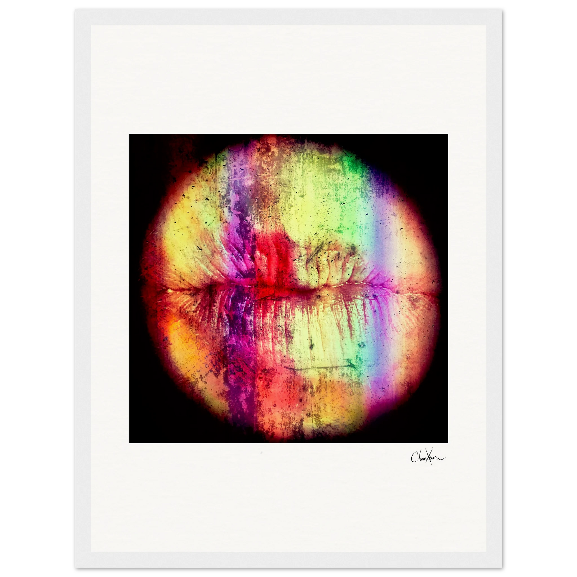 A circular abstract image resembling lips in vibrant colors and vertical bands of red, yellow, green, blue, and purple, framed in a white gallery-quality frame with a signature at the bottom right—a striking fine art print.