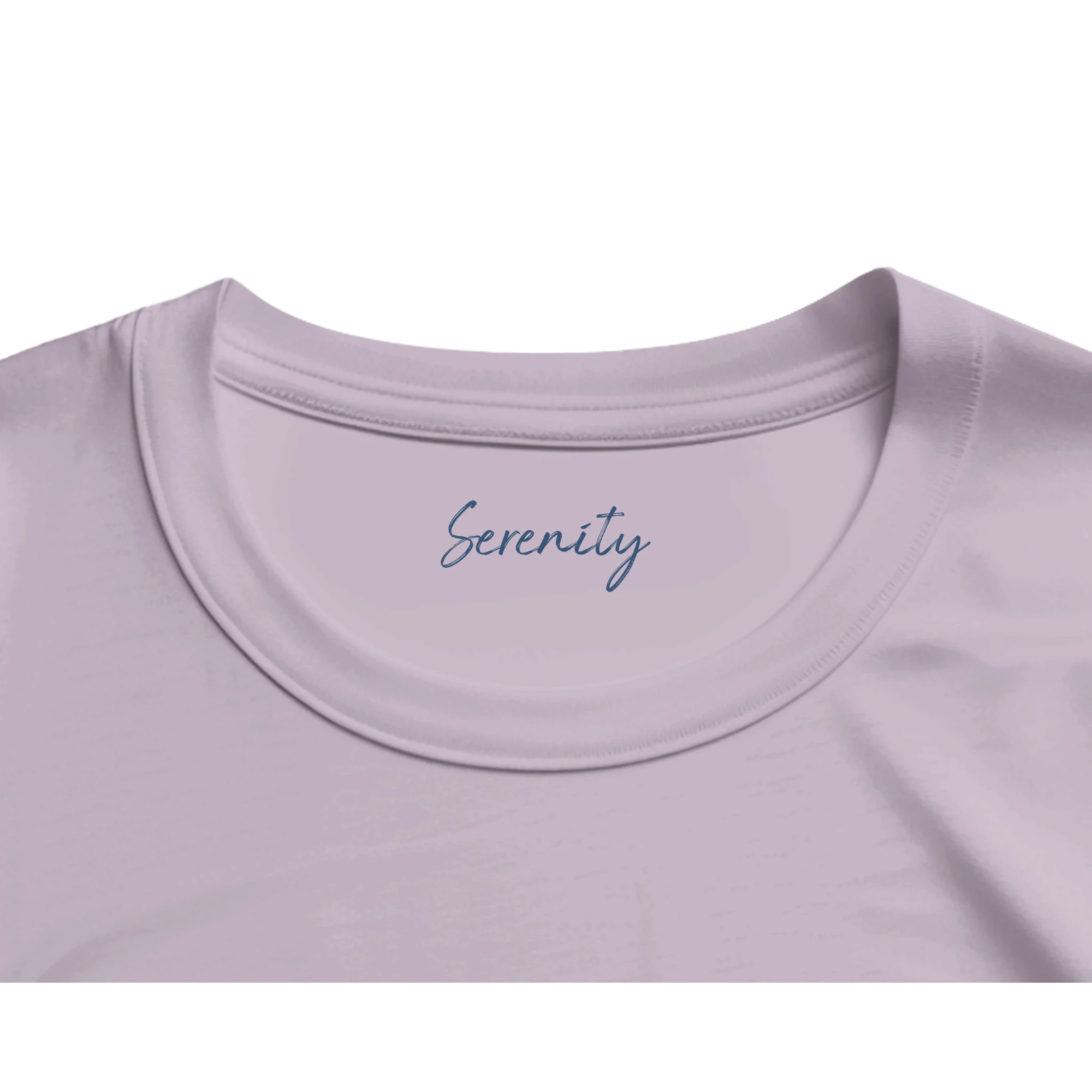 A close-up of the neckline of an organic lavender t-shirt, featuring the word Serenity printed inside the collar in blue cursive—an elegant detail for conscious fashion lovers.