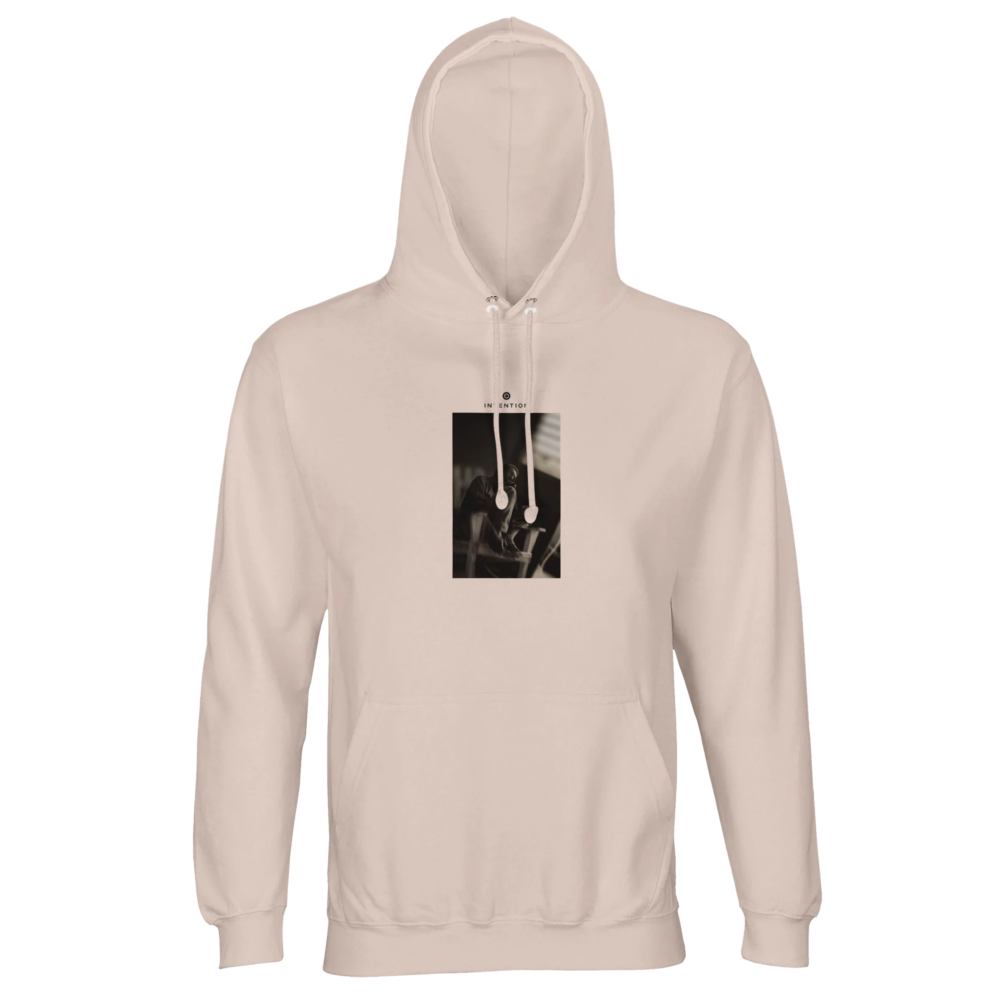 A creamy pink hooded sweatshirt with a front pocket, featuring a rectangular graphic of metal tools on the chest—crafted for those who appreciate conscious fashion.