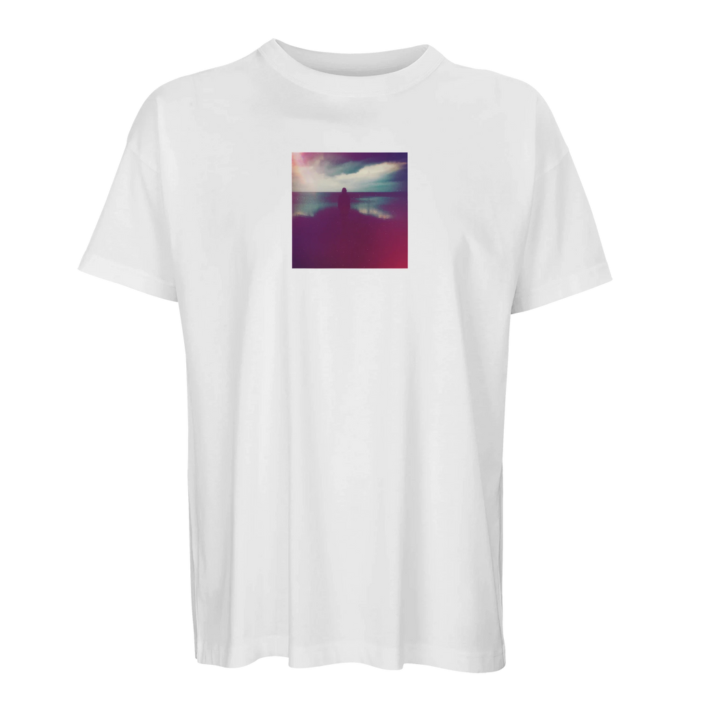 A white T-shirt crafted as mindful apparel, featuring a small, square, abstract chest print with blurred colors and a central silhouette.