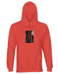 A pop orange hooded sweatshirt made from mindful apparel, featuring a rectangular black and white art print on the chest that shows a close-up of hands working with tools.