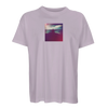 A light purple t-shirt featuring a small, square art print on the chest that shows a silhouette of a person standing with arms raised against a colorful, cloudy sky.