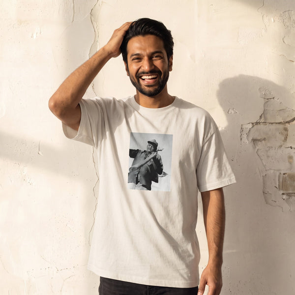 Fortitude - "Everyday Hero" Off White T-shirt worn against a sunlit plaster wall