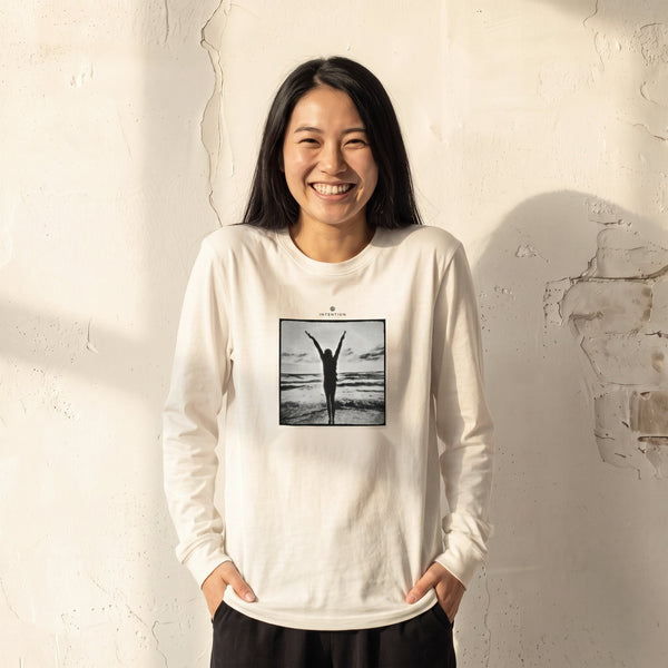 Grateful - "Circle of Life" Off White Long Sleeve worn against a sunlit plaster wall