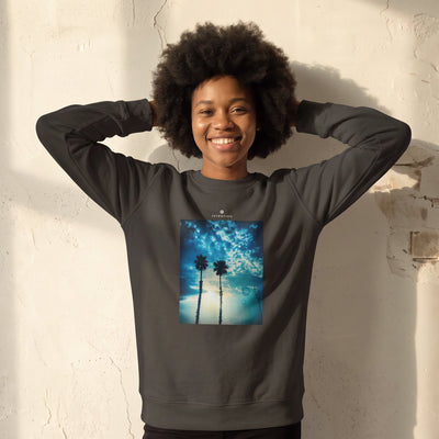 Gratitude - "Bubbles and Sky Sticks" deep charcoal grey Sweatshirt worn against a sunlit plaster wall