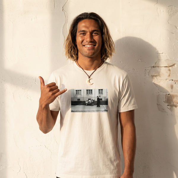 Oneness - "The Urban Matrix" Off White T-shirt worn against a sunlit plaster wall