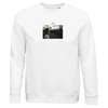 A white crew-neck sweatshirt with a small, centered black-and-white outdoor photo of a person and "INTERFERIS." text above—perfect for mindful, conscious fashion enthusiasts.