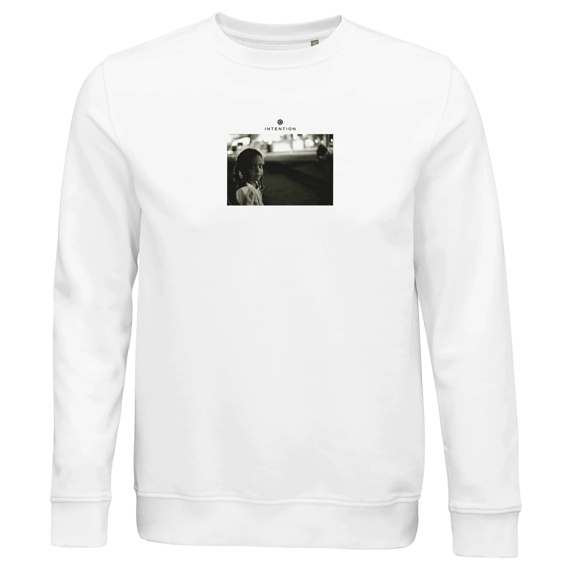 A white crew-neck sweatshirt with a small, centered black-and-white outdoor photo of a person and "INTERFERIS." text above—perfect for mindful, conscious fashion enthusiasts.