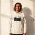 Presence - "Cuba Girl" Off White Hoodie worn against a sunlit plaster wall
