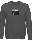 A Grey Melange organic crewneck sweatshirt featuring a small, centered black-and-white art print of a woman facing the camera with a blurred background and "YESTERDAY" printed above.