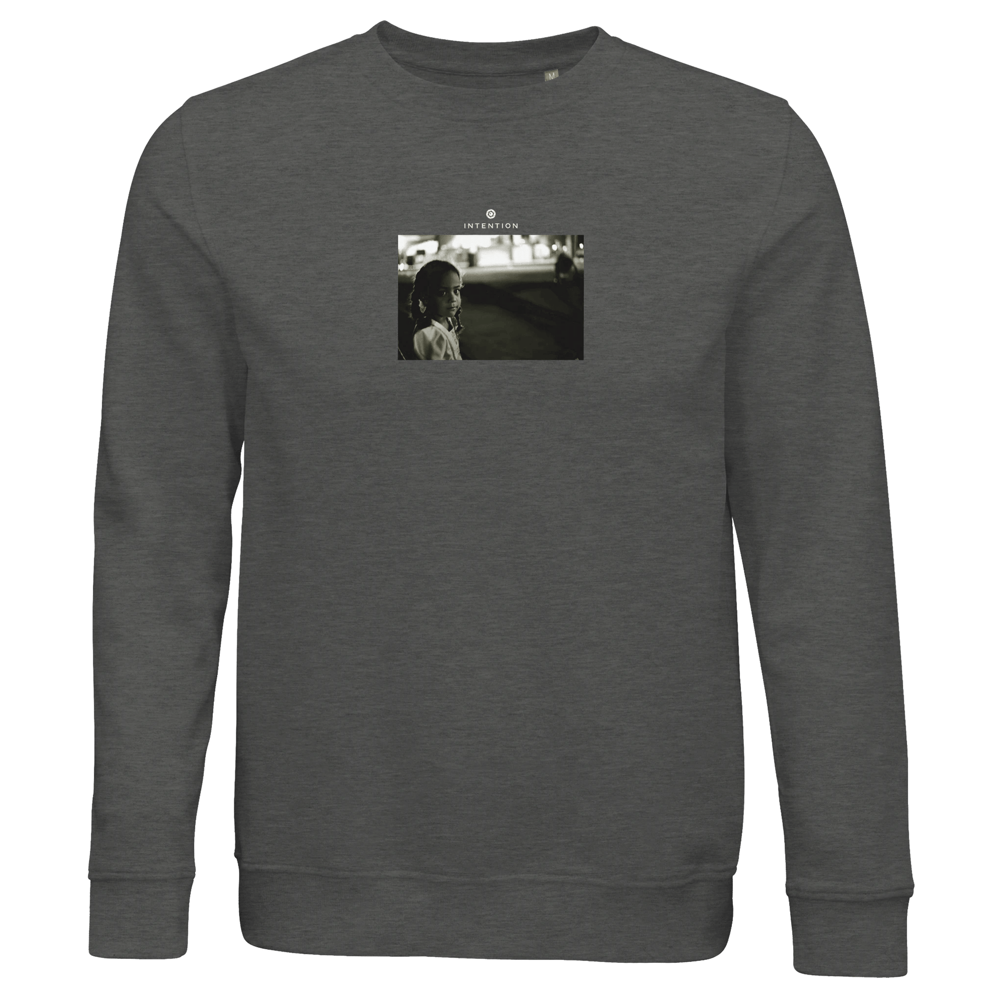 A Grey Melange organic crewneck sweatshirt featuring a small, centered black-and-white art print of a woman facing the camera with a blurred background and "YESTERDAY" printed above.