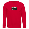 A red sweatshirt with a small rectangular black-and-white art print on the chest showing a person outdoors, plus partially visible text above the photo for a mindful apparel touch.