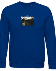 A royal blue sweatshirt with a centered black-and-white photo of a person facing the camera and “YOUTHVISION” above the image—designed for those who value mindful apparel and thoughtful design.