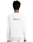 A person with short, dark hair is shown from the back wearing a plain white sweatshirt featuring the word Presence in black script on the upper back. This mindful apparel piece stands out against a white background.