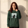 Strength - "Misty Mind" Bottle Green Sweatshirt worn against a sunlit plaster wall